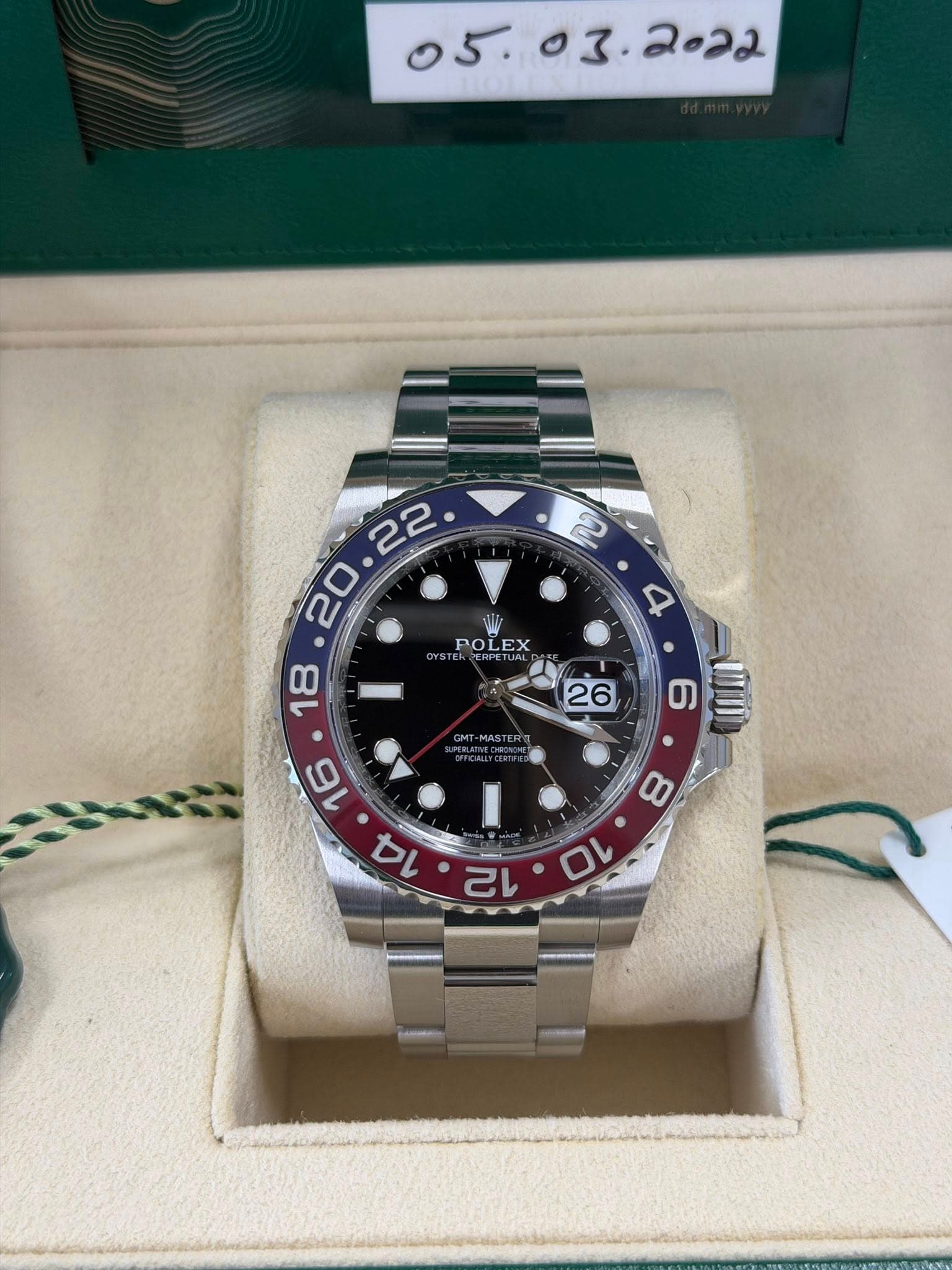May be an image of wrist watch and text