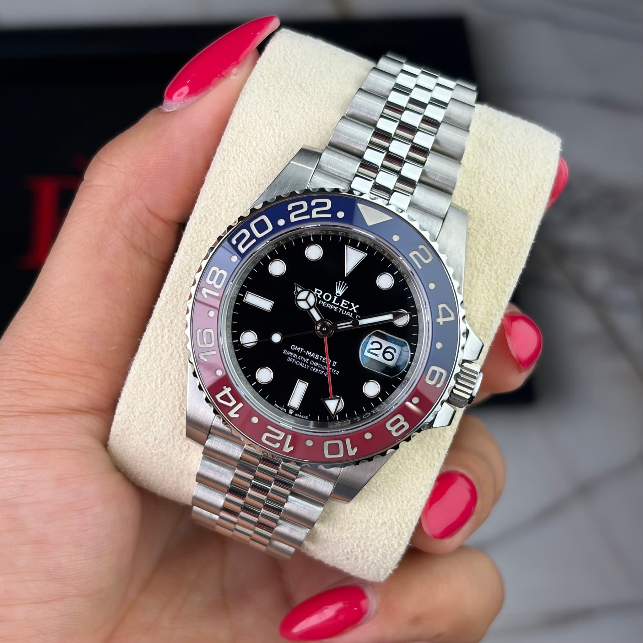 May be an image of wrist watch and text