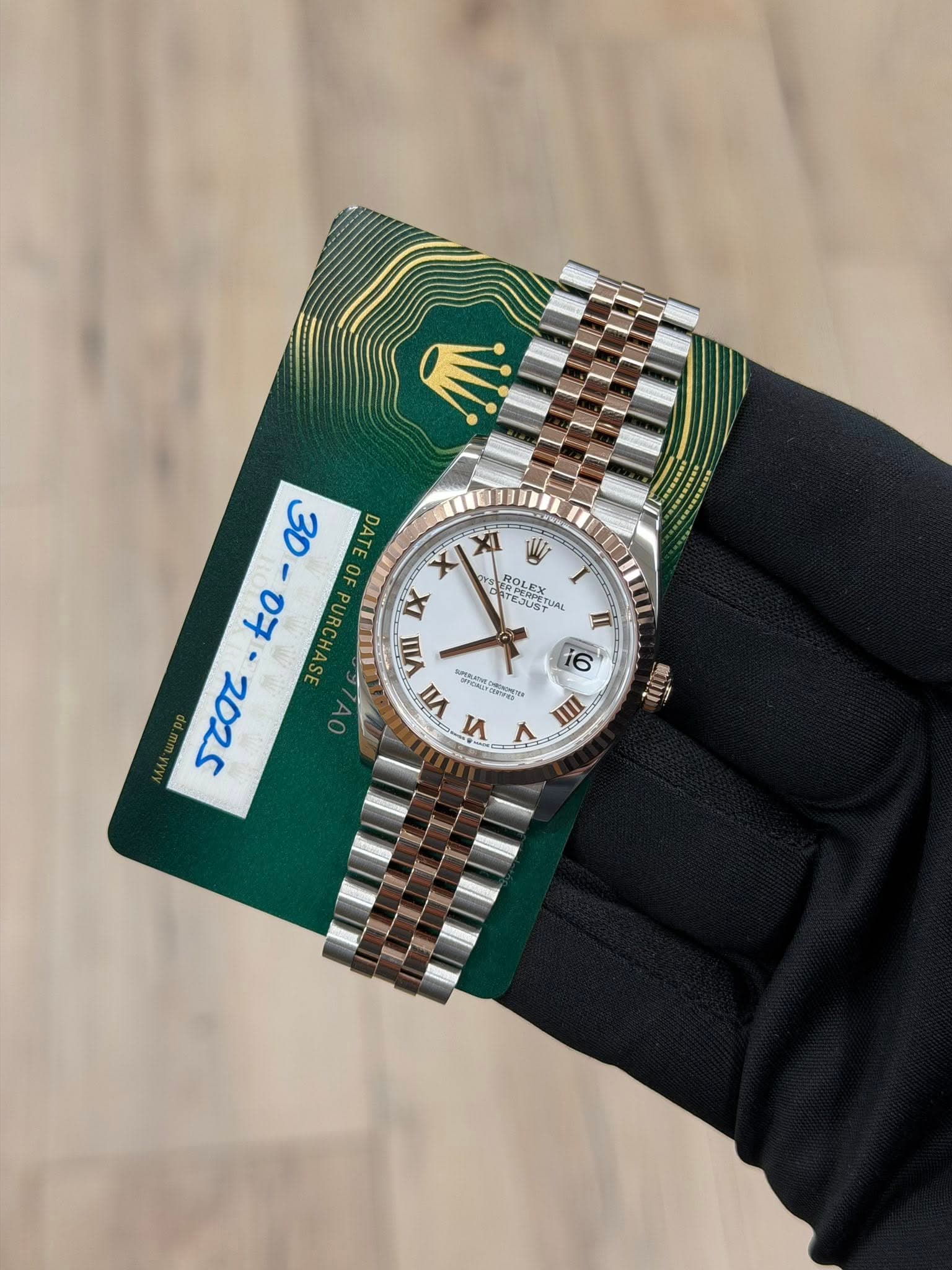 May be an image of wrist watch and text