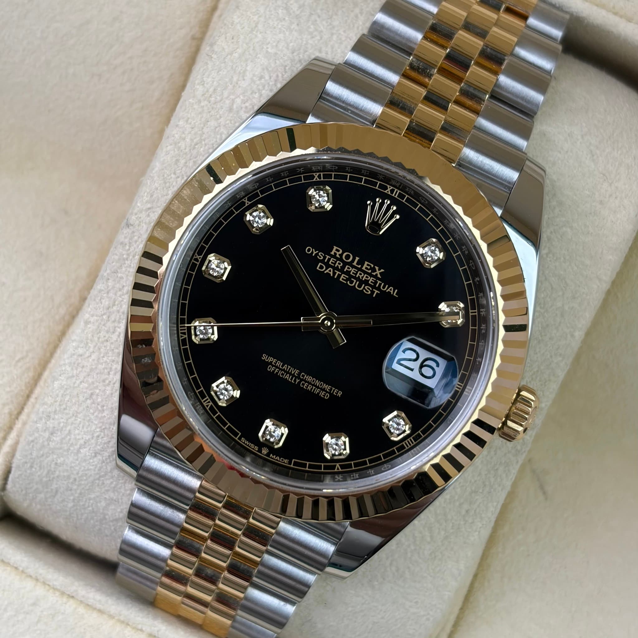 May be an image of wrist watch and text