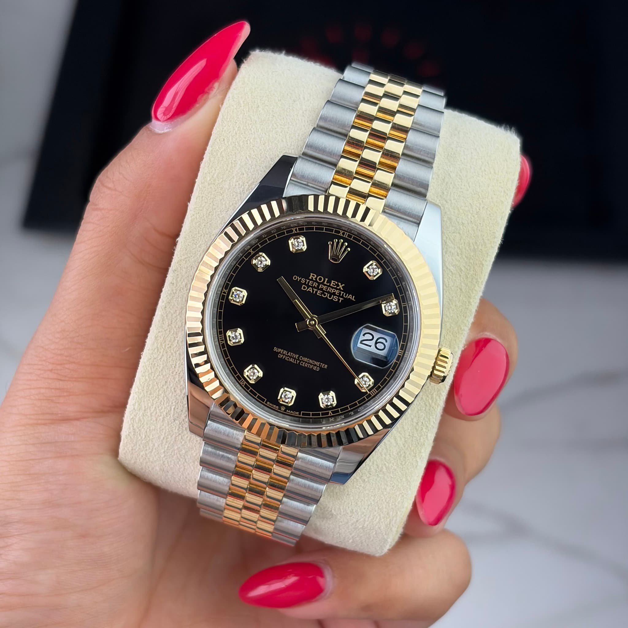 May be an image of wrist watch and text