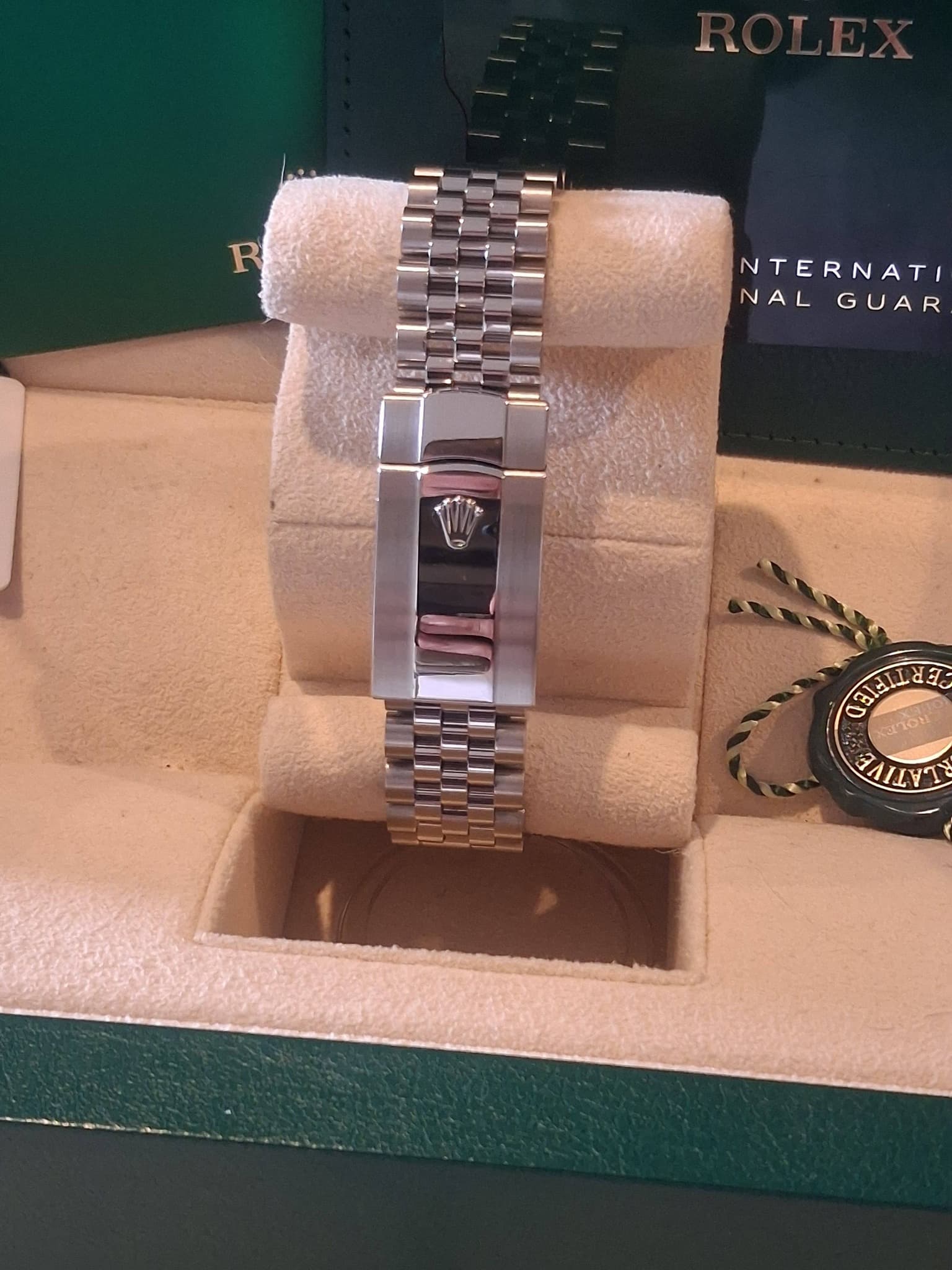May be an image of wrist watch and text