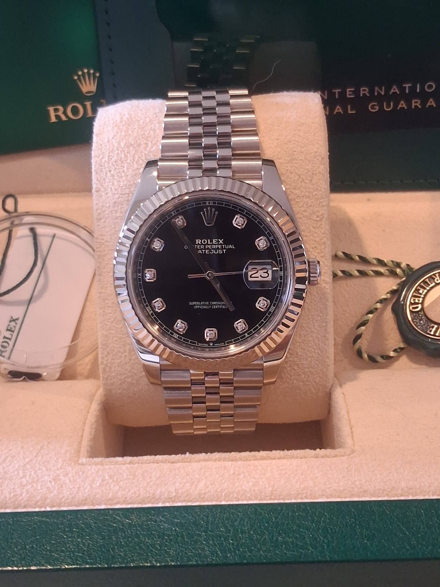 May be an image of wrist watch and text