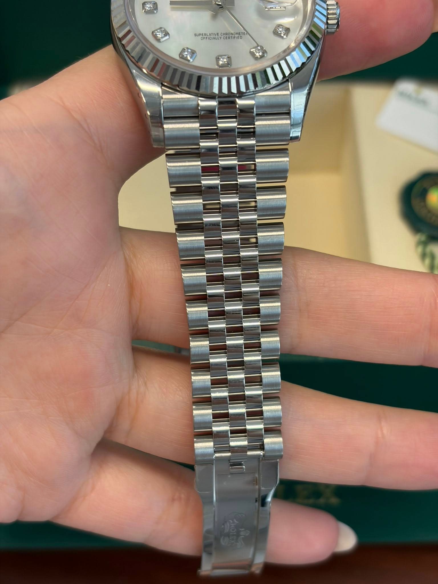 May be an image of wrist watch and text