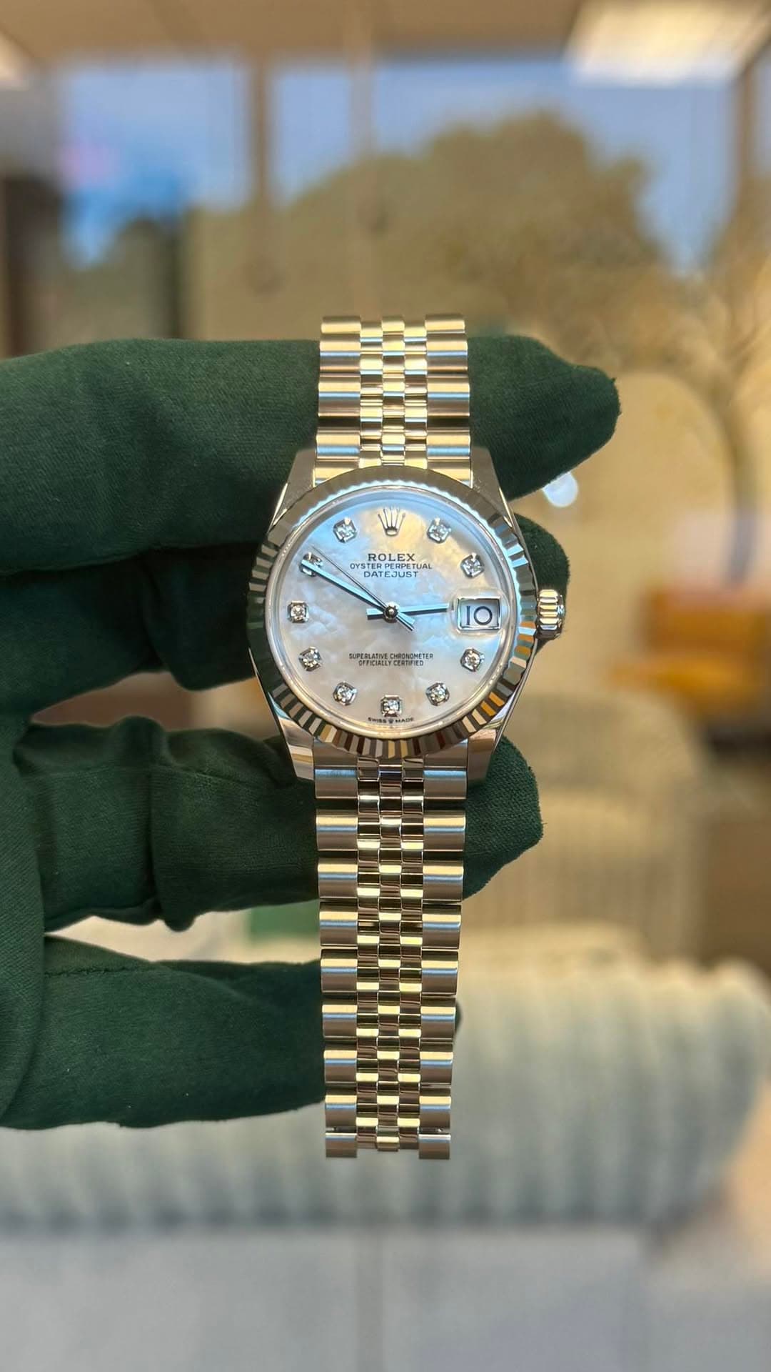 May be an image of wrist watch and text