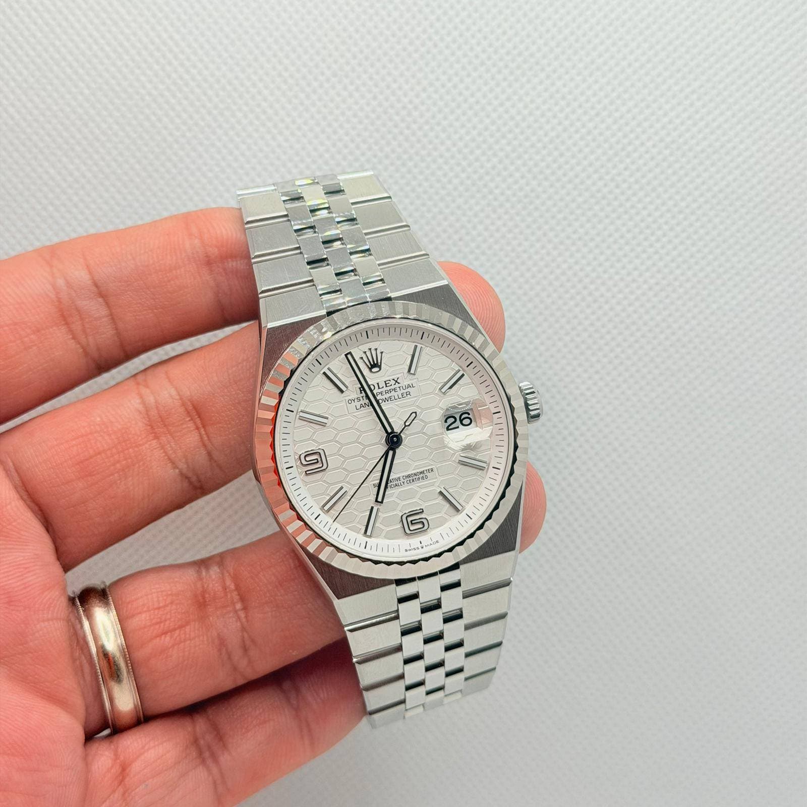 May be an image of wrist watch and text