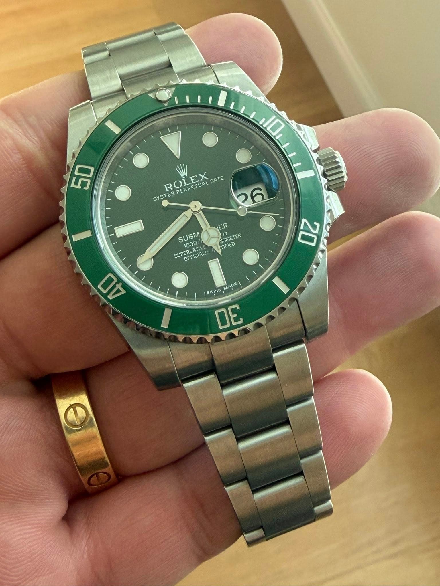 May be an image of wrist watch and text that says '50 ROLEX PERPETUALDAT ERPETUAL DATE OYSTER 26 NER SUBM SUBM 1pO SOMICTER SUPER SUPERLAT OFF OFTIGIALLT LOCRLATI GRLATIVL RLATIVL…