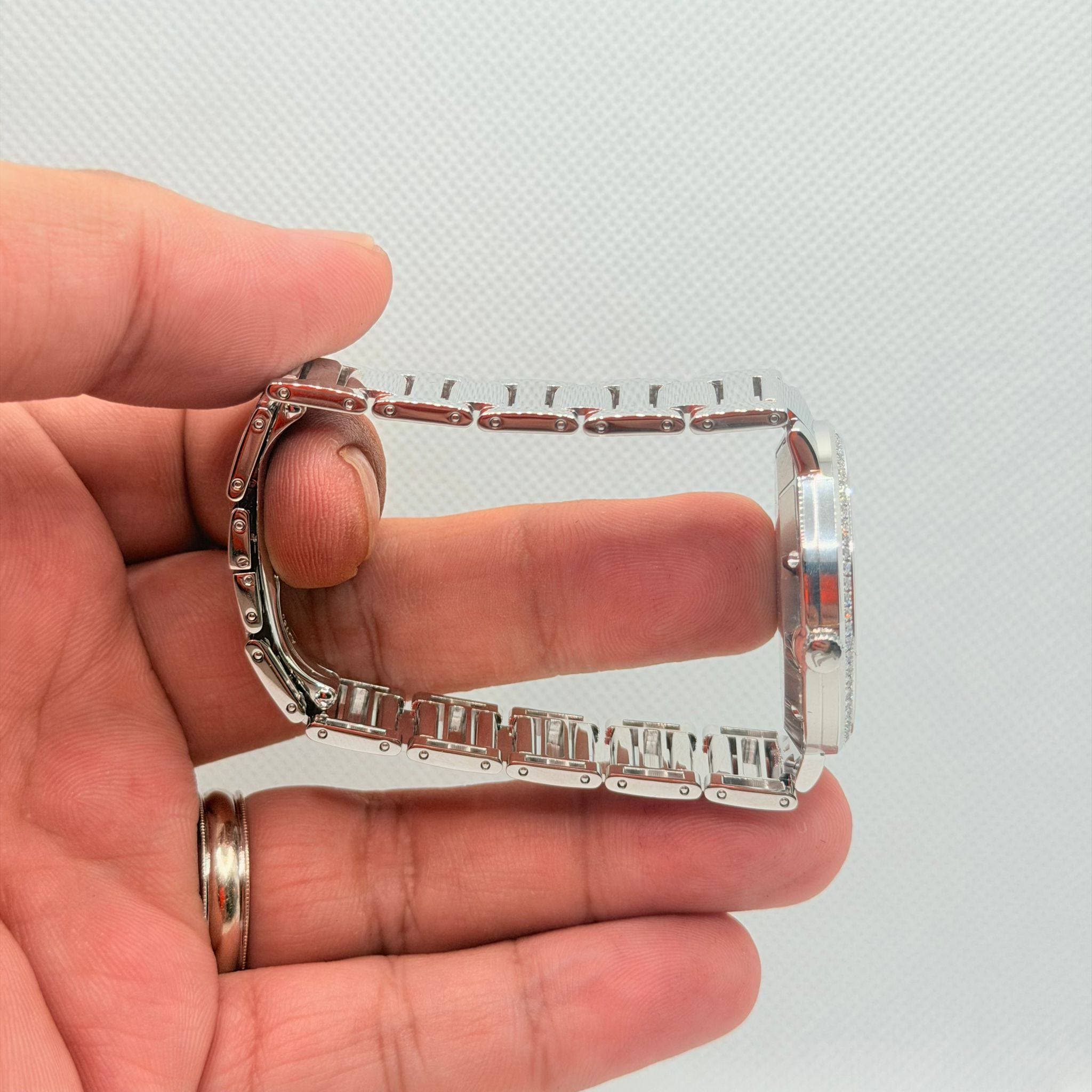 May be an image of jewelry and wrist watch