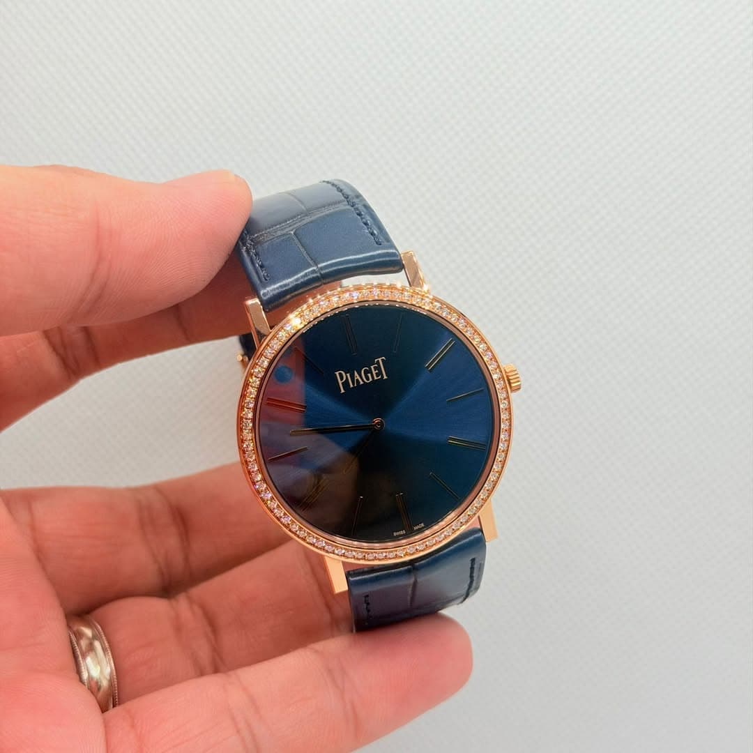 May be an image of wrist watch and text that says 'PIAGET PIAGET'