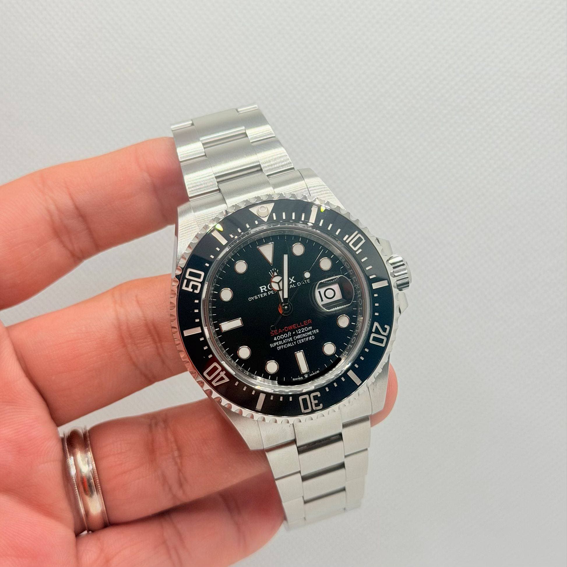 May be an image of wrist watch and text