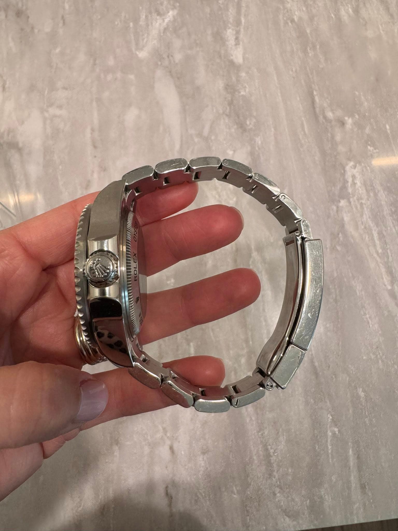 May be an image of wrist watch