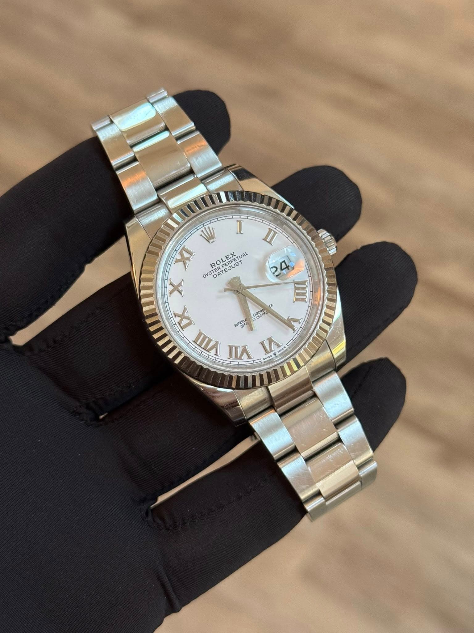 May be an image of wrist watch and text