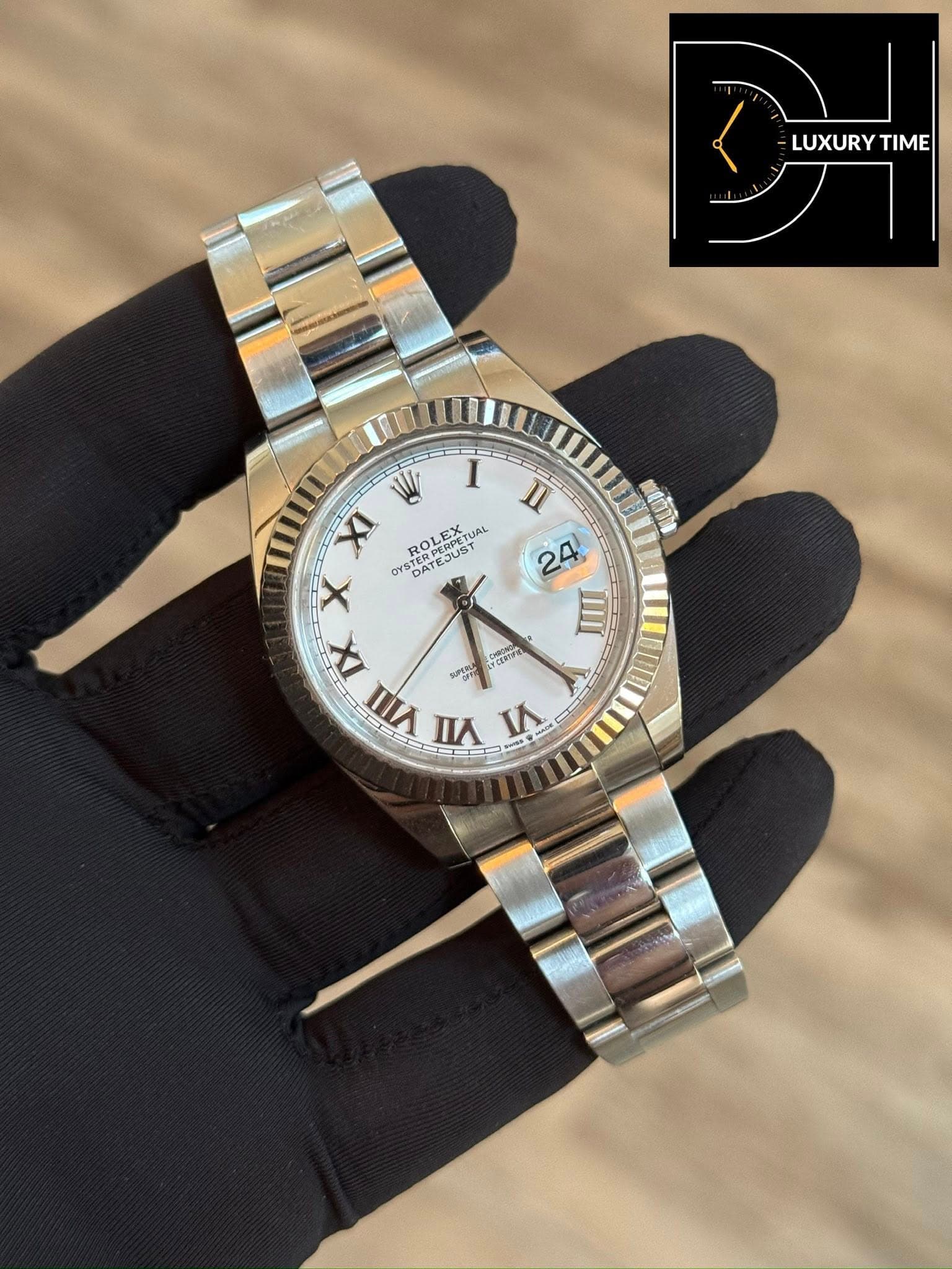 May be an image of wrist watch and text
