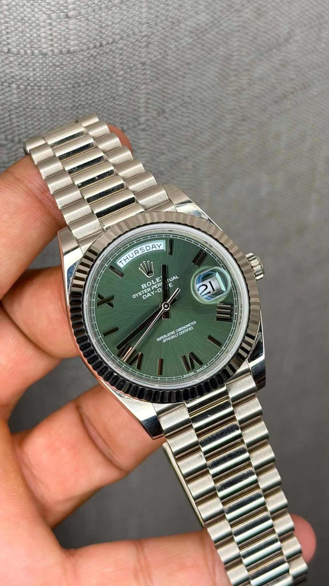 May be an image of wrist watch and text