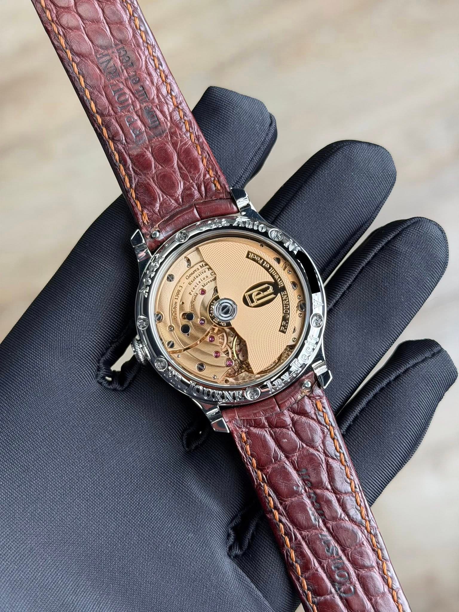 May be an image of wrist watch, leather and text