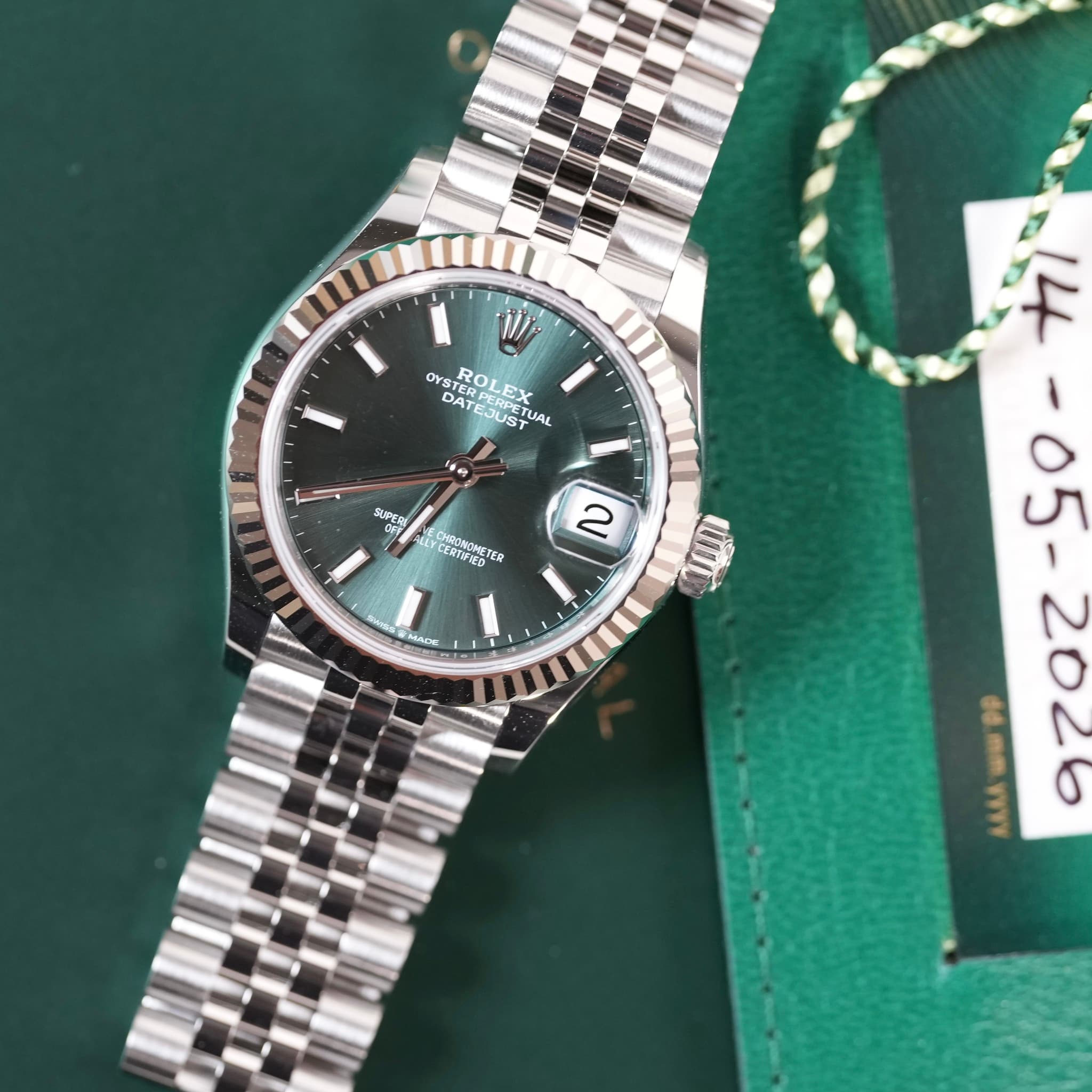 May be an image of wrist watch and text
