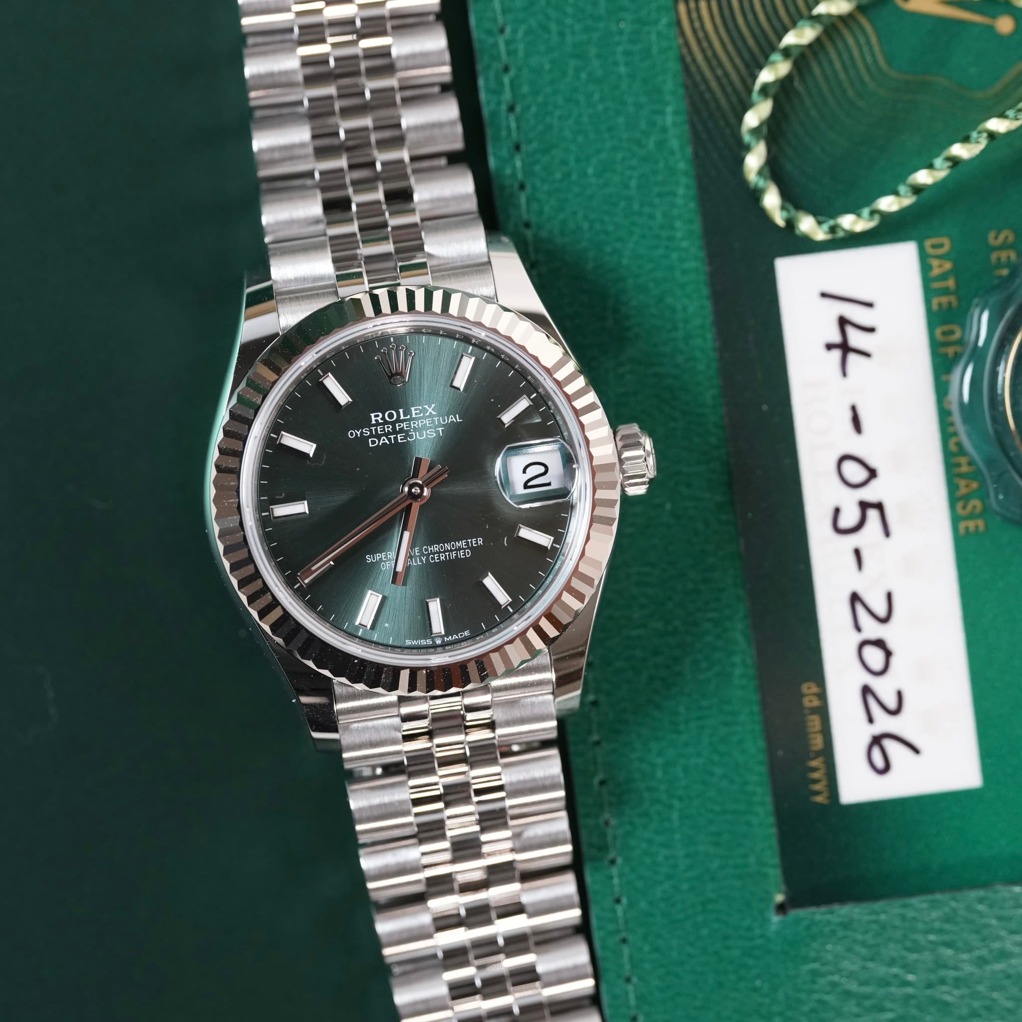 May be an image of wrist watch and text