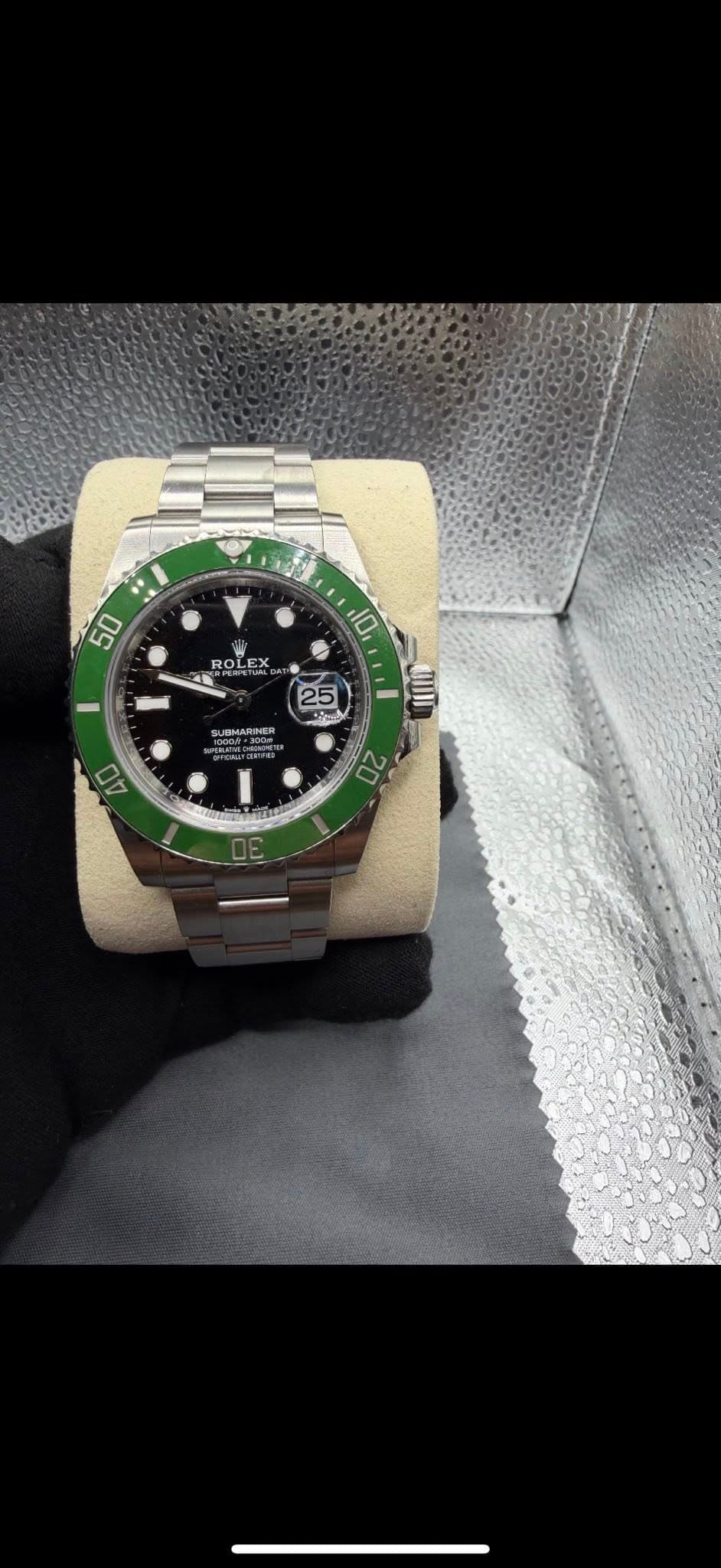 May be an image of wrist watch and text that says '50 ROLEX 10 25 JEMARNER 40 40 20'
