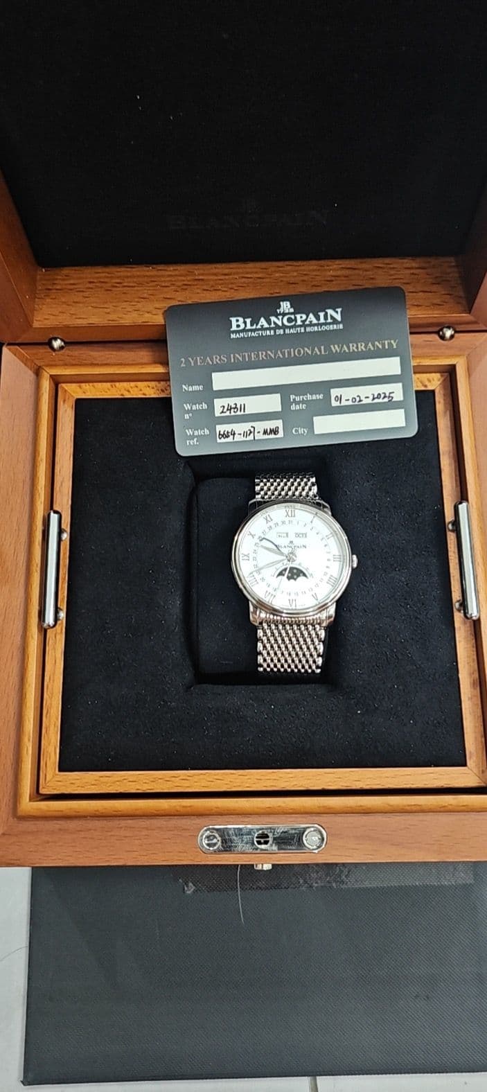May be an image of golf, wrist watch and text that says 'JB BLA BLANCPAIN NCPAIN INOSLOGEN MASUINETEN ZVEARSINTERNATIONALWA LVEARSINTERNATIONALWARRANTY 2YEARS NTERNATIONAL WARRANTY…