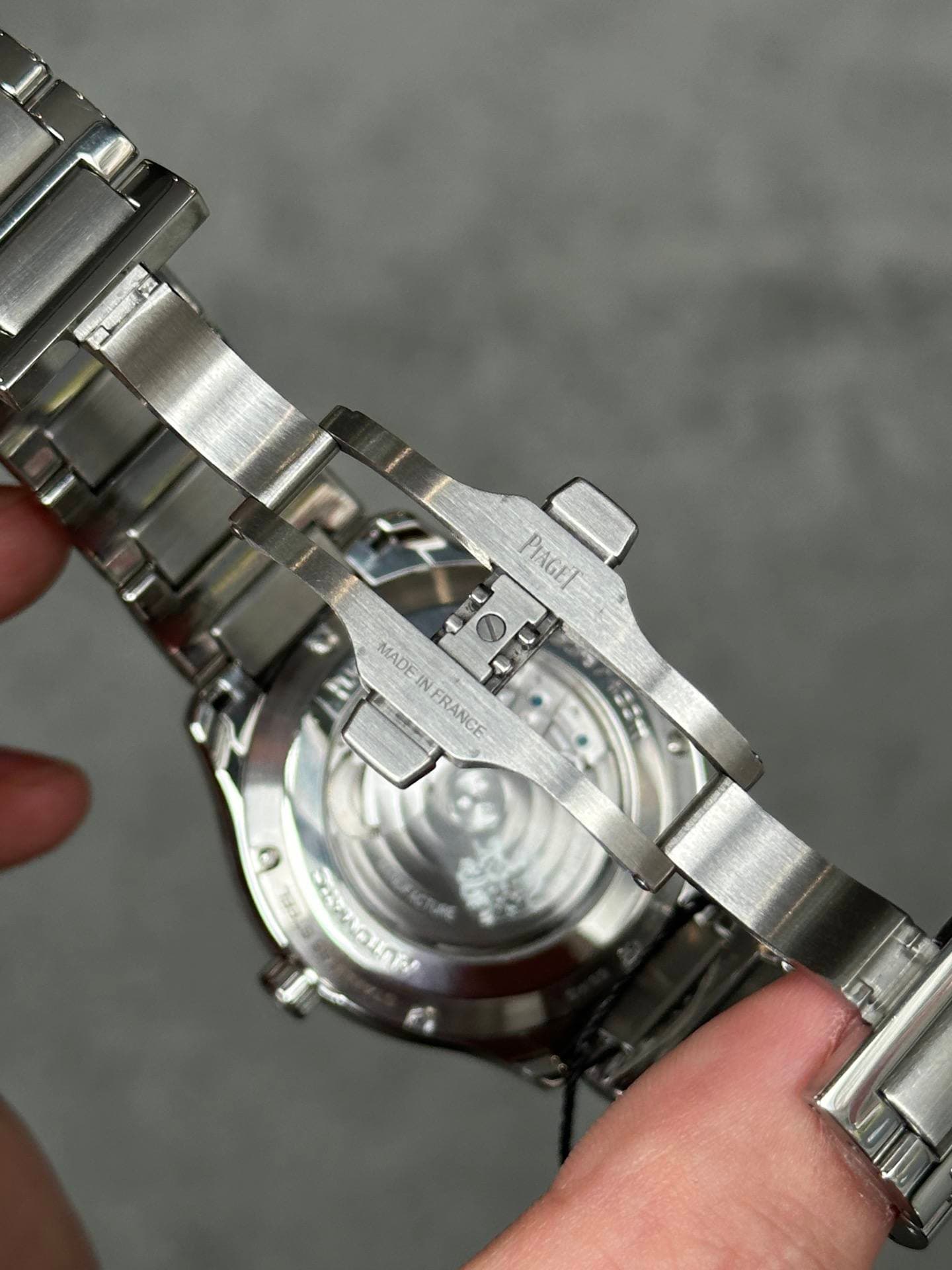 May be an image of wrist watch and text