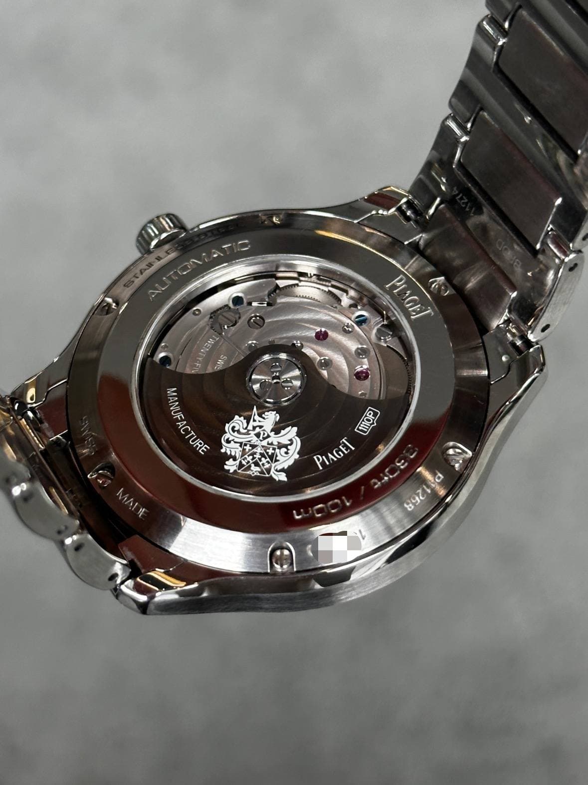 May be an image of wrist watch and text