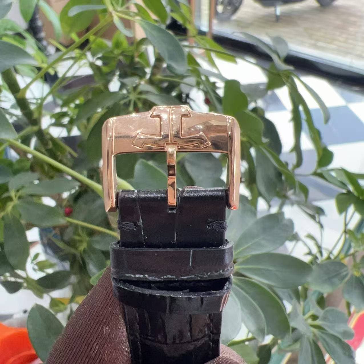 May be an image of wrist watch, leather and saddle-stitched leather
