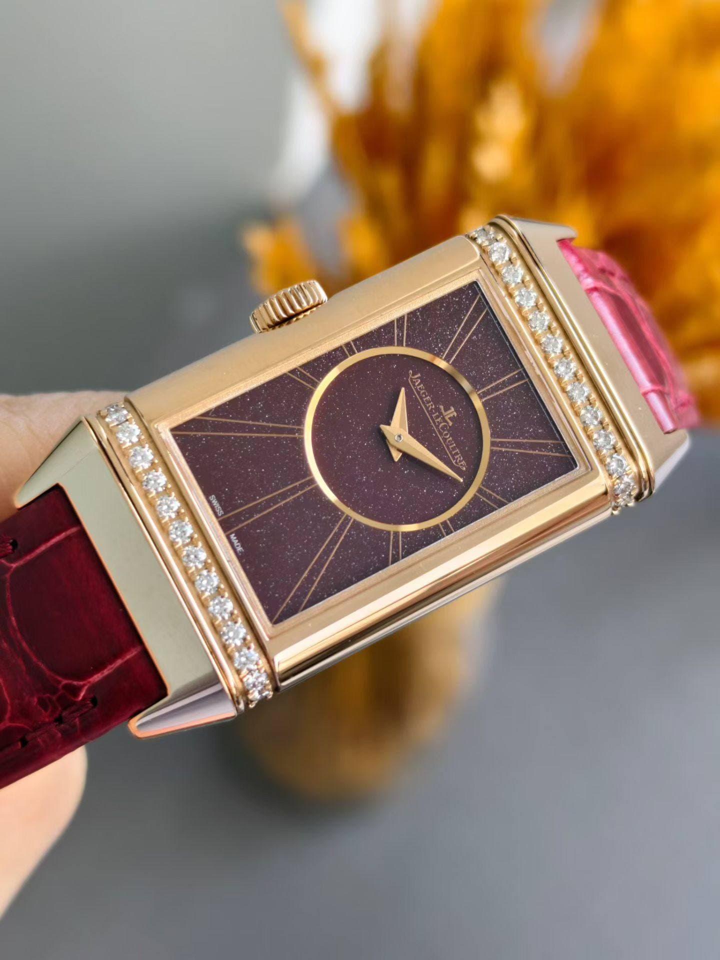 May be an image of wrist watch and text
