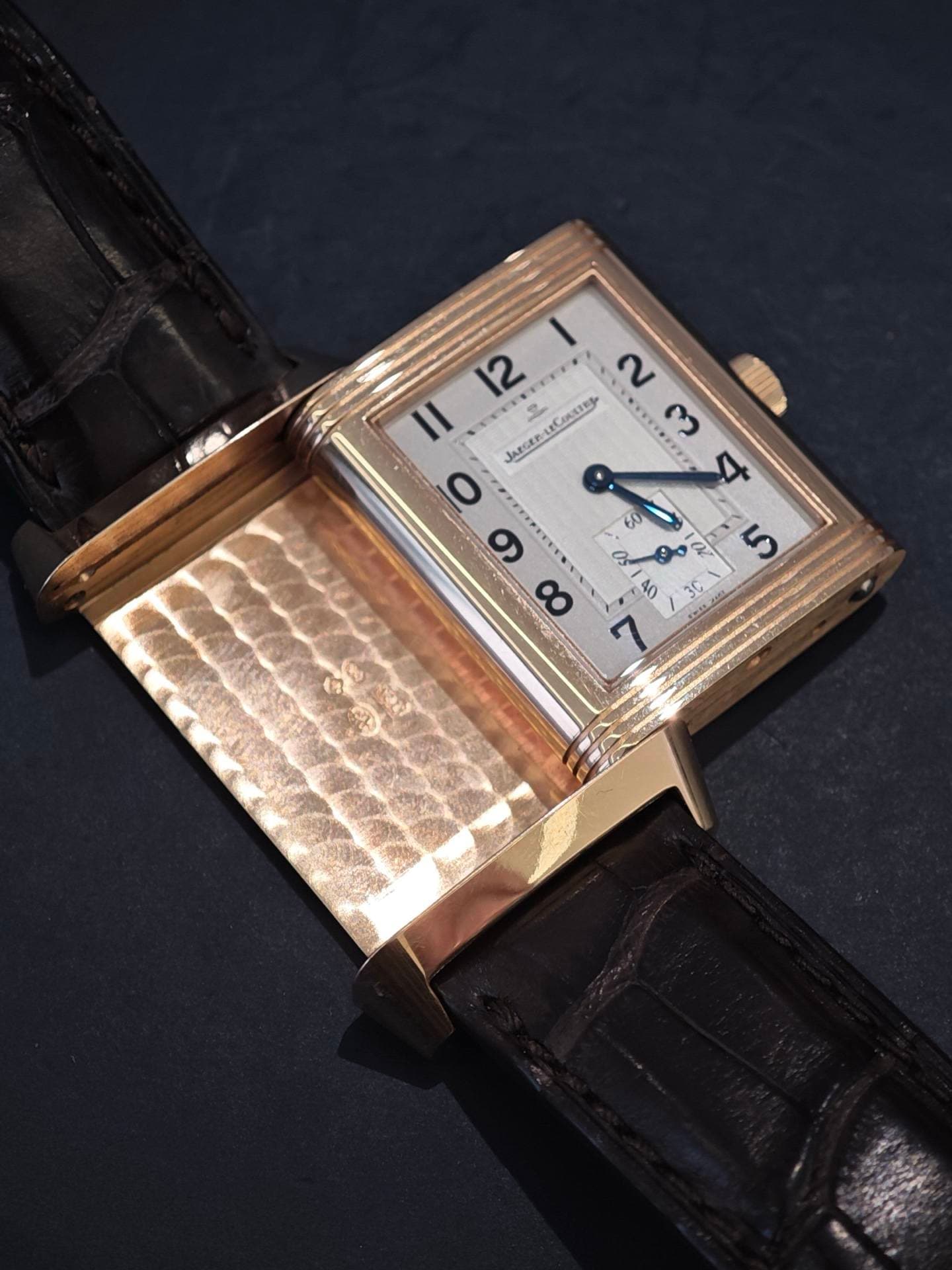 May be an image of wrist watch and text