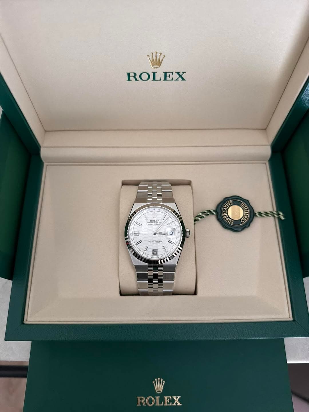 May be an image of wrist watch and text