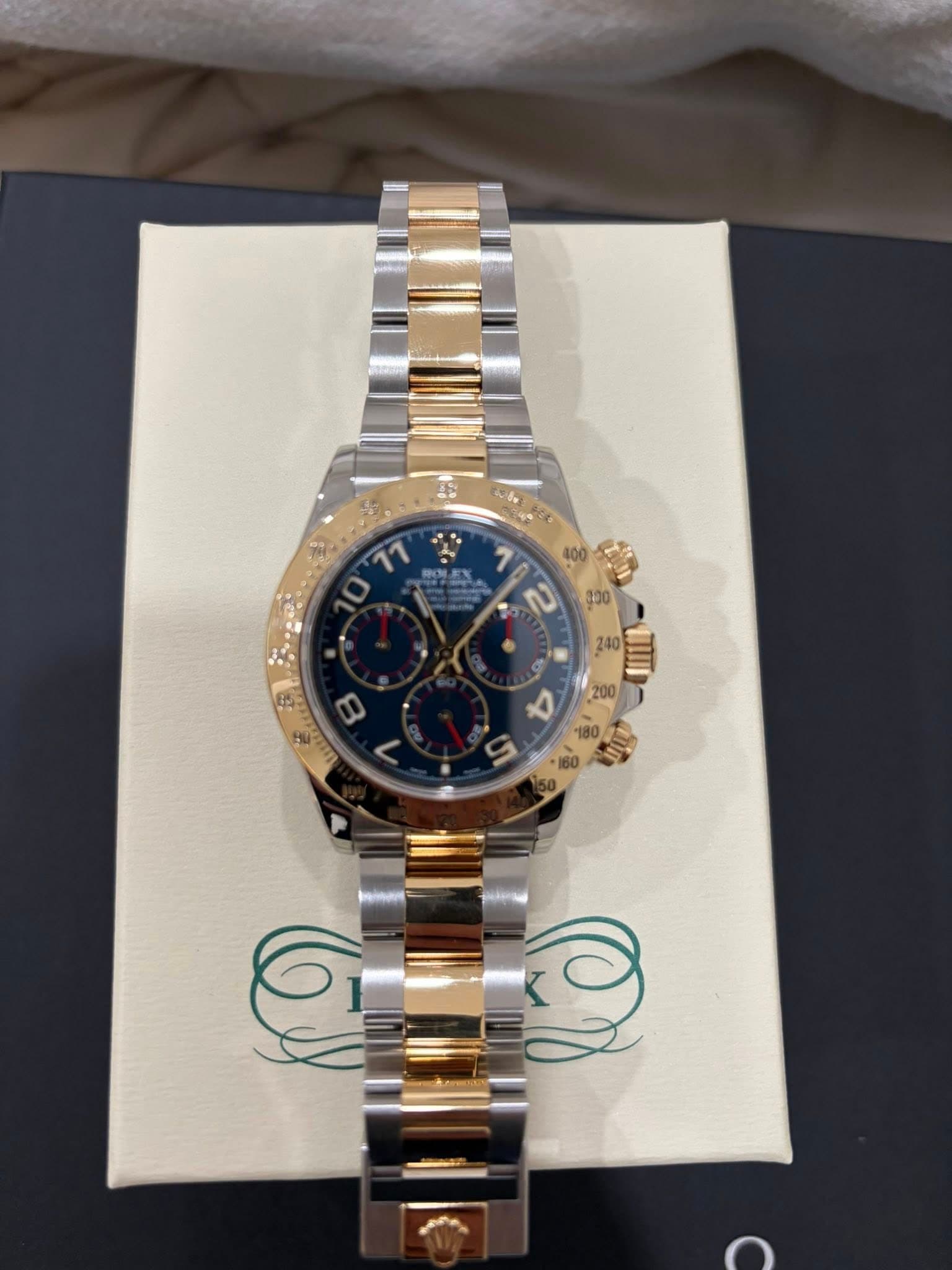 May be an image of wrist watch and text