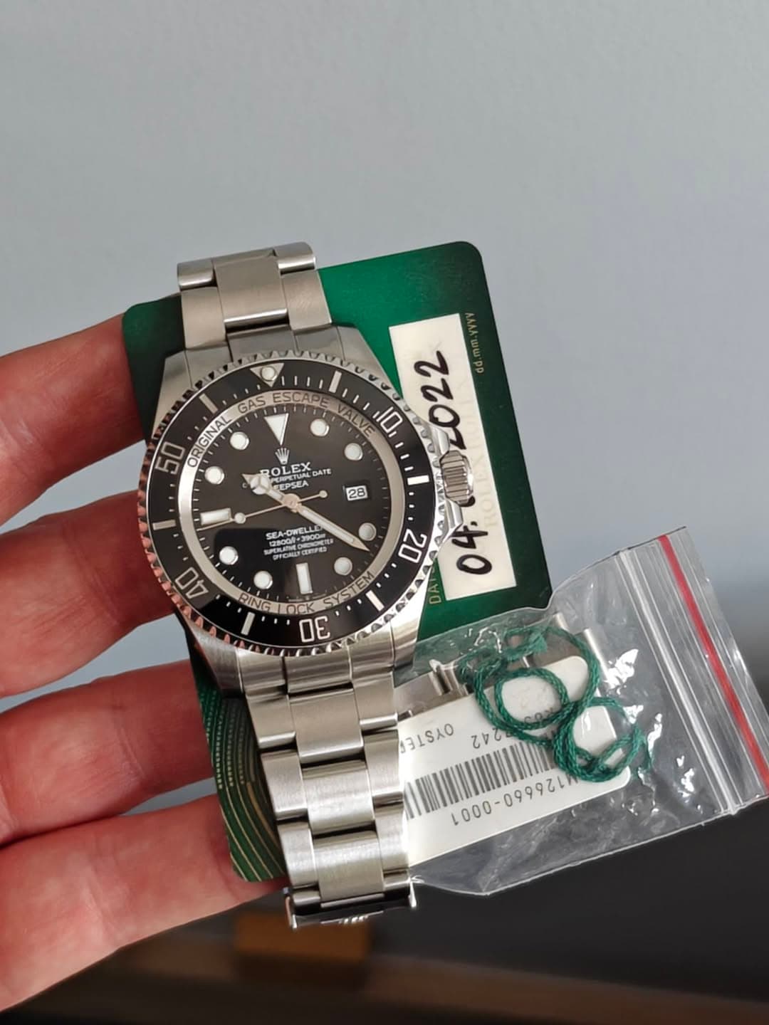 May be an image of wrist watch and text