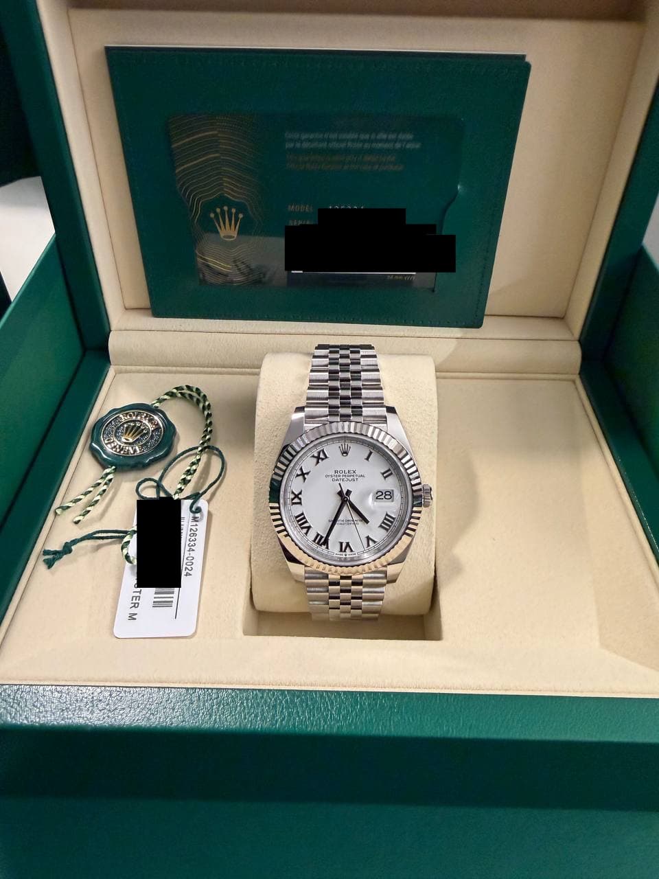 May be an image of wrist watch and text