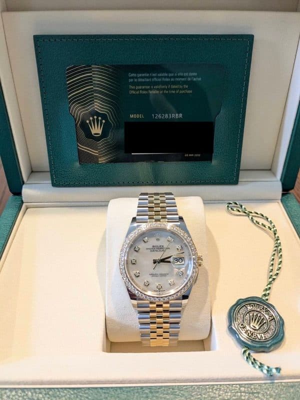 May be an image of wrist watch and text