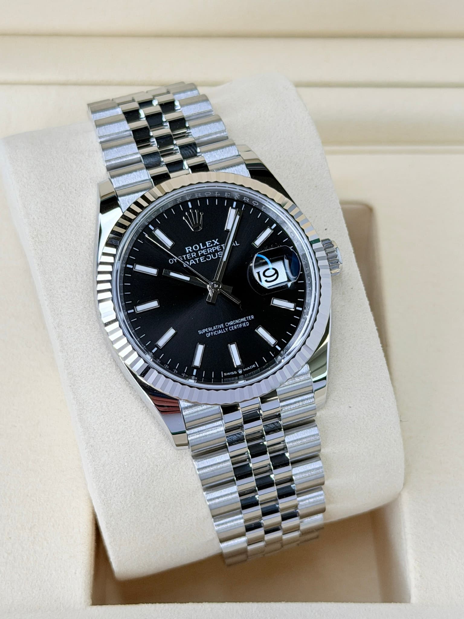 May be an image of wrist watch and text