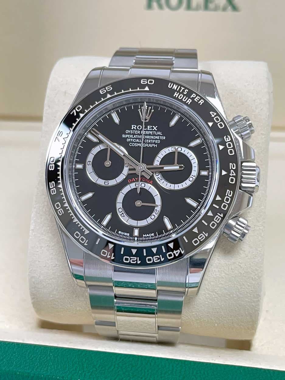 May be an image of wrist watch and text that says 'ЛOWEχ ROLEX RO EX OYSTER SUPERLATIVE ANIANARONOMET CHRONOMETER COSMIGRAPH COSMIG COSMO GRAPH 9 80 3 န 1 1 6 A 0 V O 85 90 UNITS…