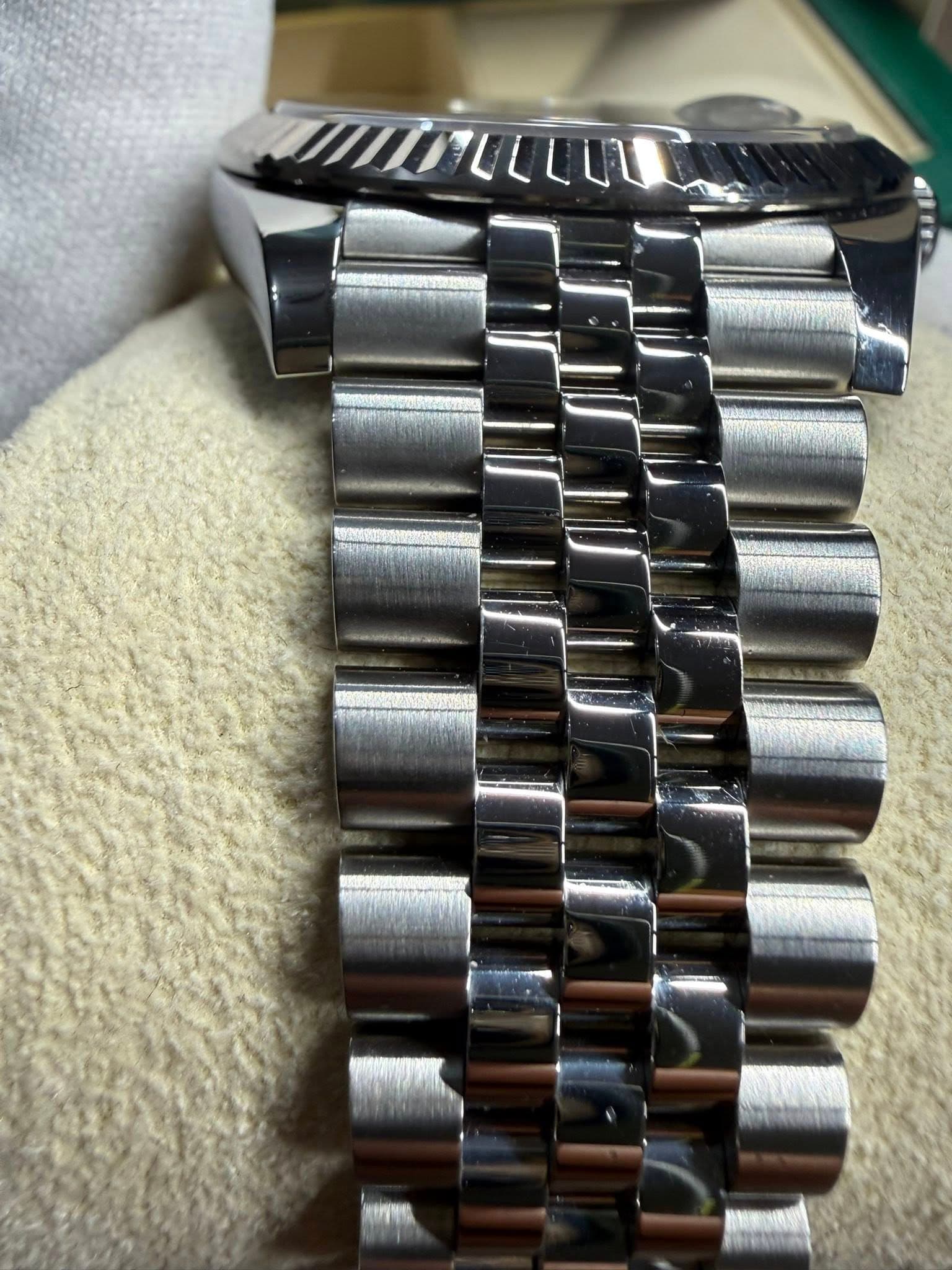 May be an image of wrist watch and text