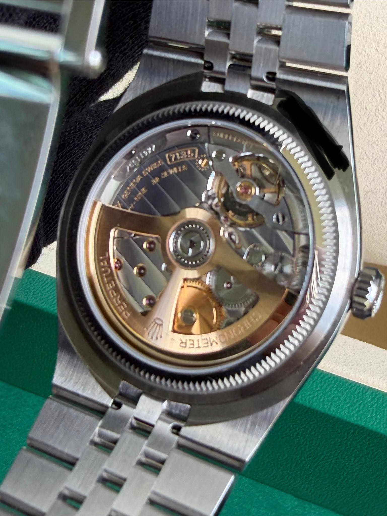 May be an image of wrist watch and text