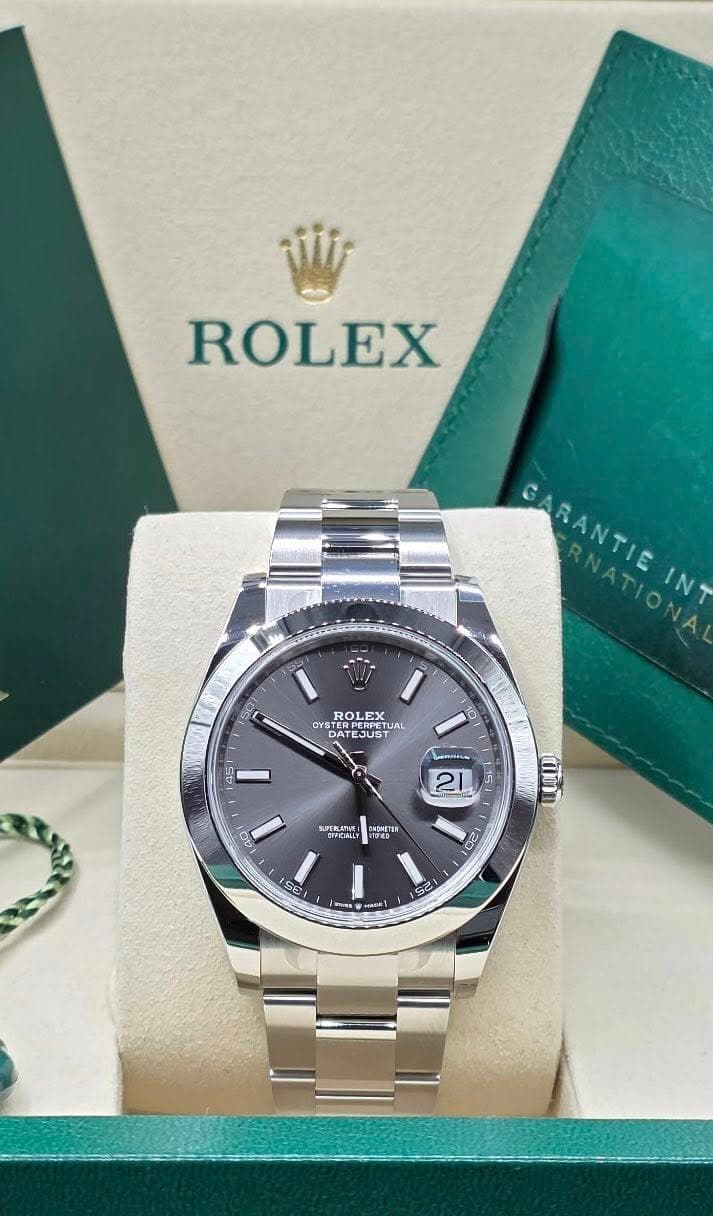 May be an image of wrist watch and text that says 'ROLEX GARANTIE BANTIEN RNATIONA RNATIONA INT S0 ROLEX 2X OYST TER TUA DAT ATEJUST PERPETUR ATE EJUS PERITA EJUST O ဝ 6/ BAONETE…