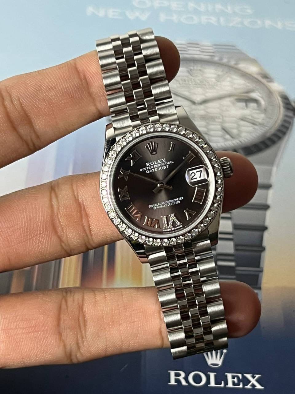 May be an image of wrist watch and text