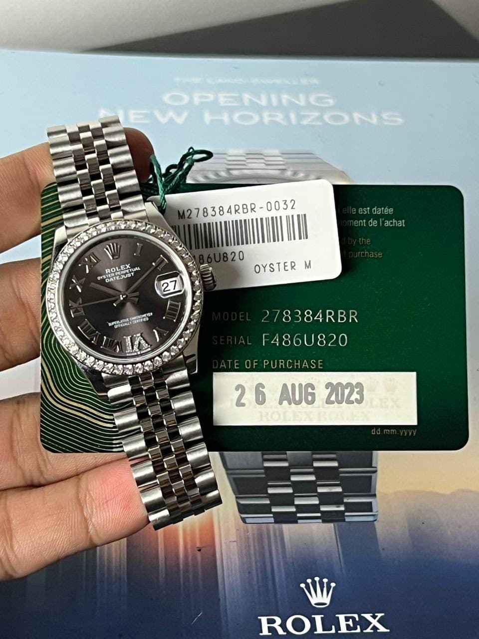 May be an image of wrist watch and text that says 'OPENING EW HORIZONS 278384RBR- / ROL ROLEX DATEJUST GATESUSY ATEJUST est.datée tdel'achat achat 20 OYSTER m 27 BROMTEN Ce…