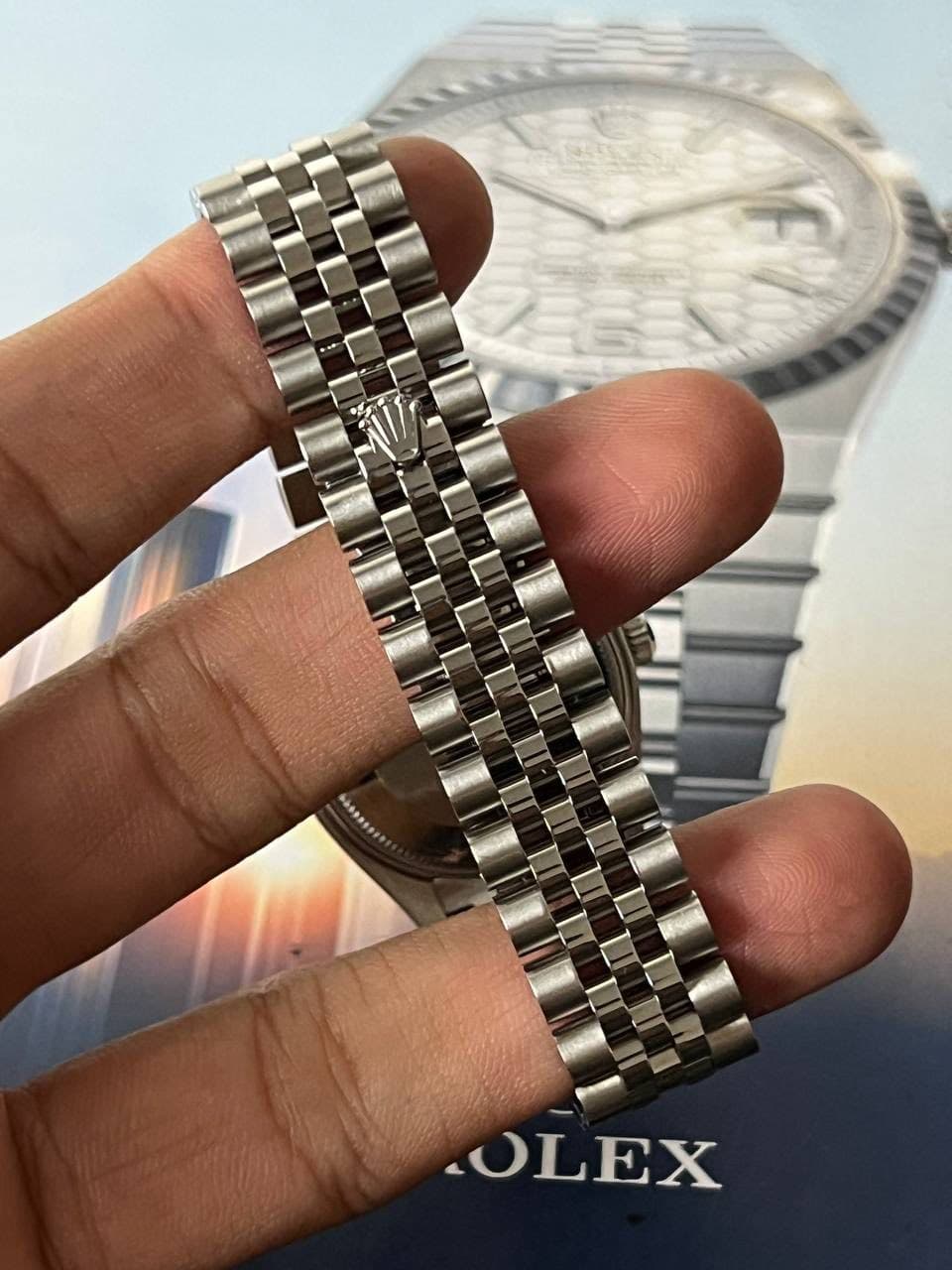 May be an image of wrist watch and text