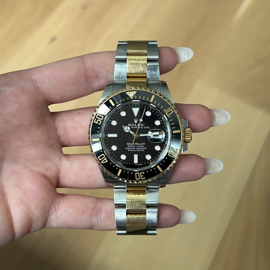 May be an image of wrist watch and text