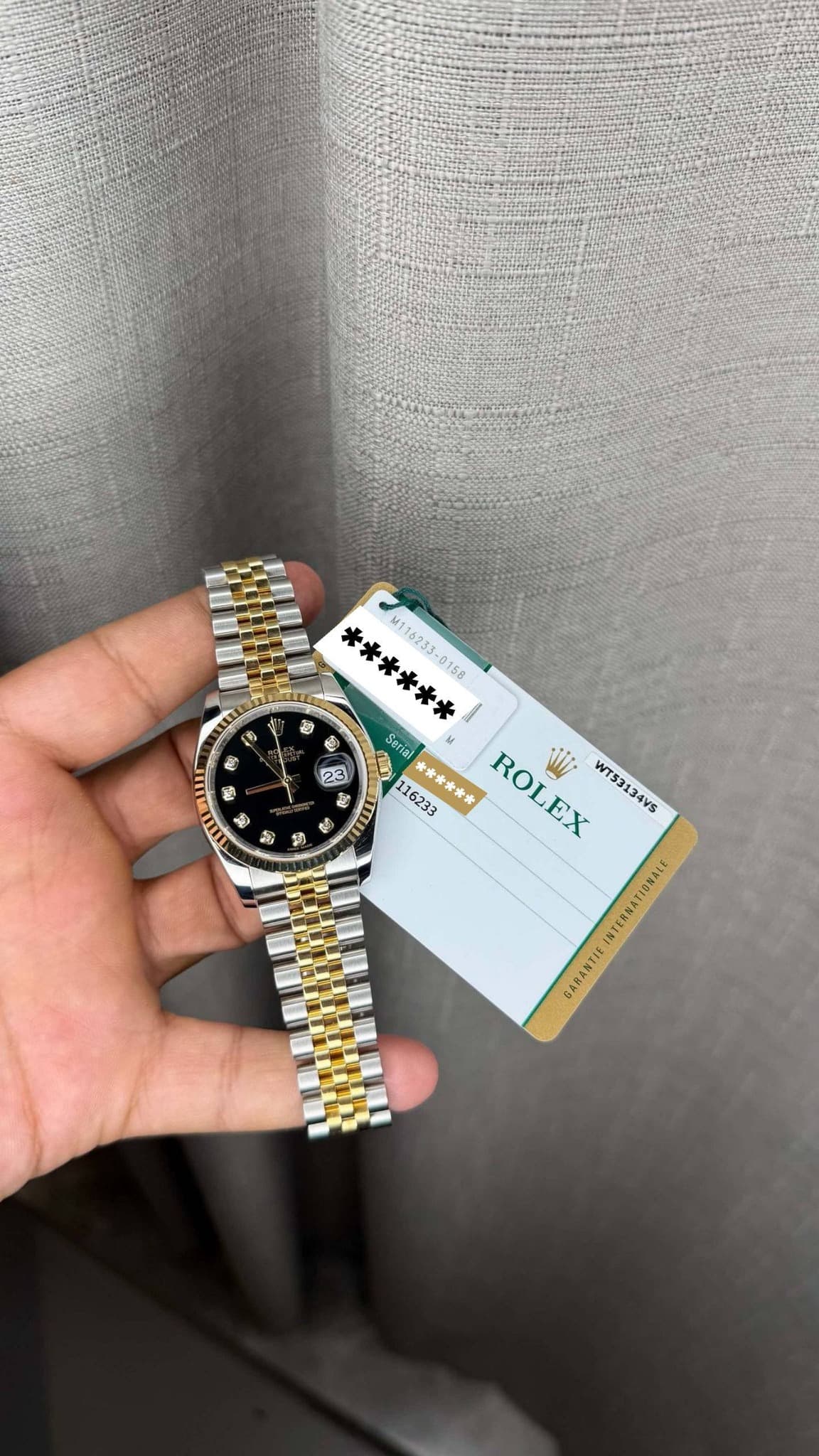 May be an image of digital watch and text that says 'ੴন ខុ 動 ****** 158 Serial 央津冷香米 ROLEX i WT53134VS ال ំ හි GARANTIE'