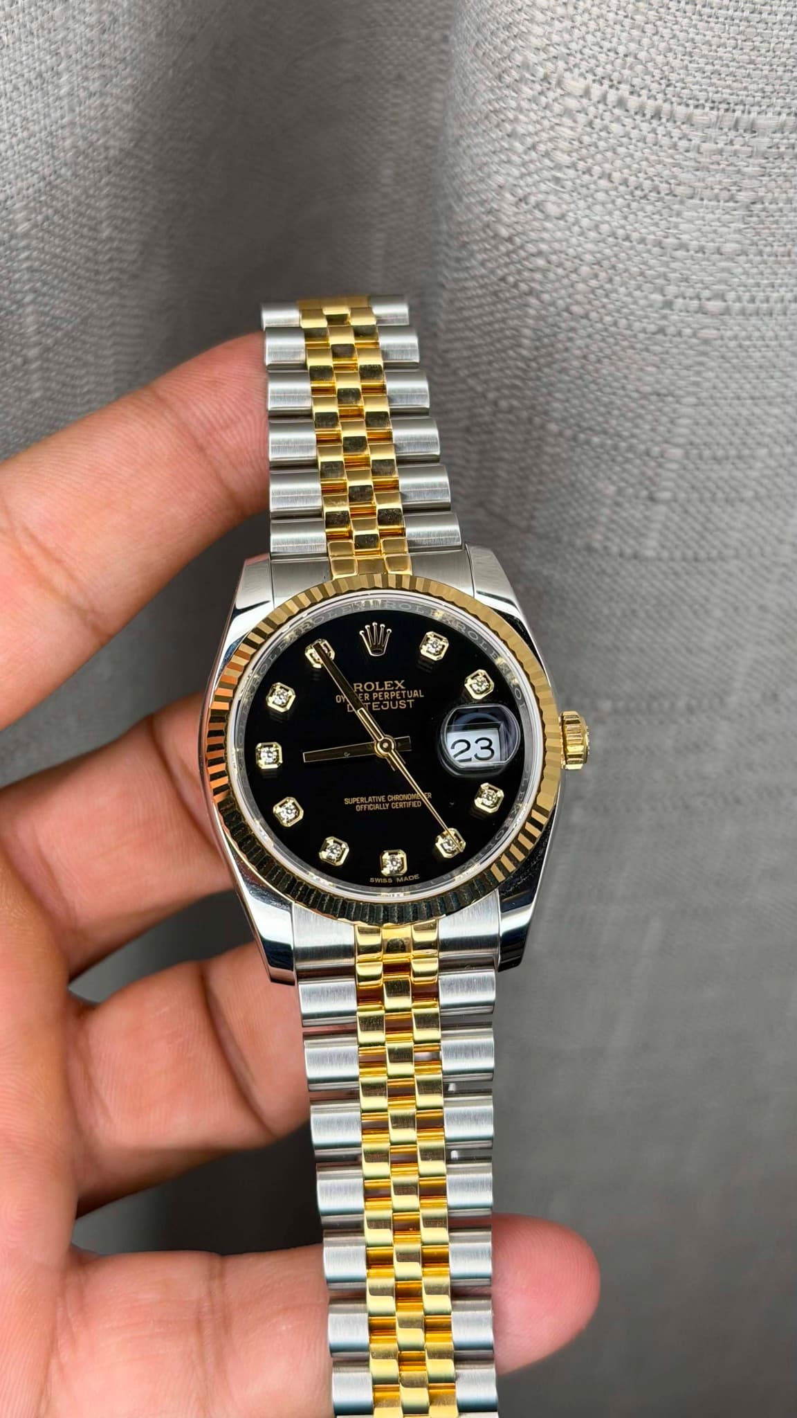May be an image of wrist watch and text