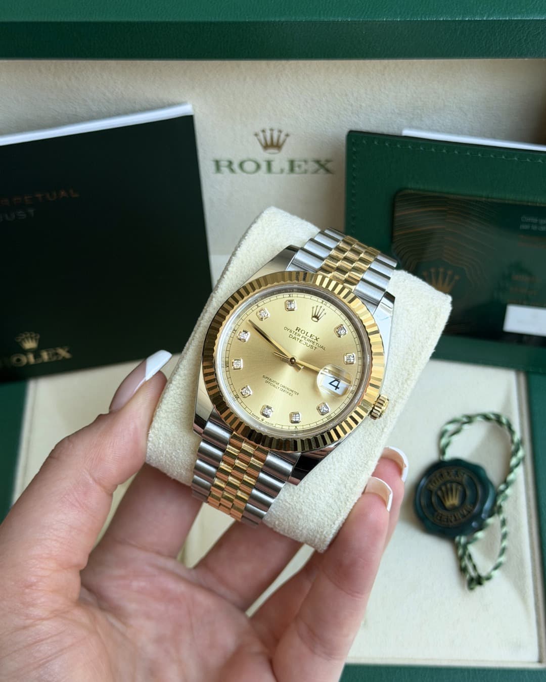 May be an image of wrist watch and text