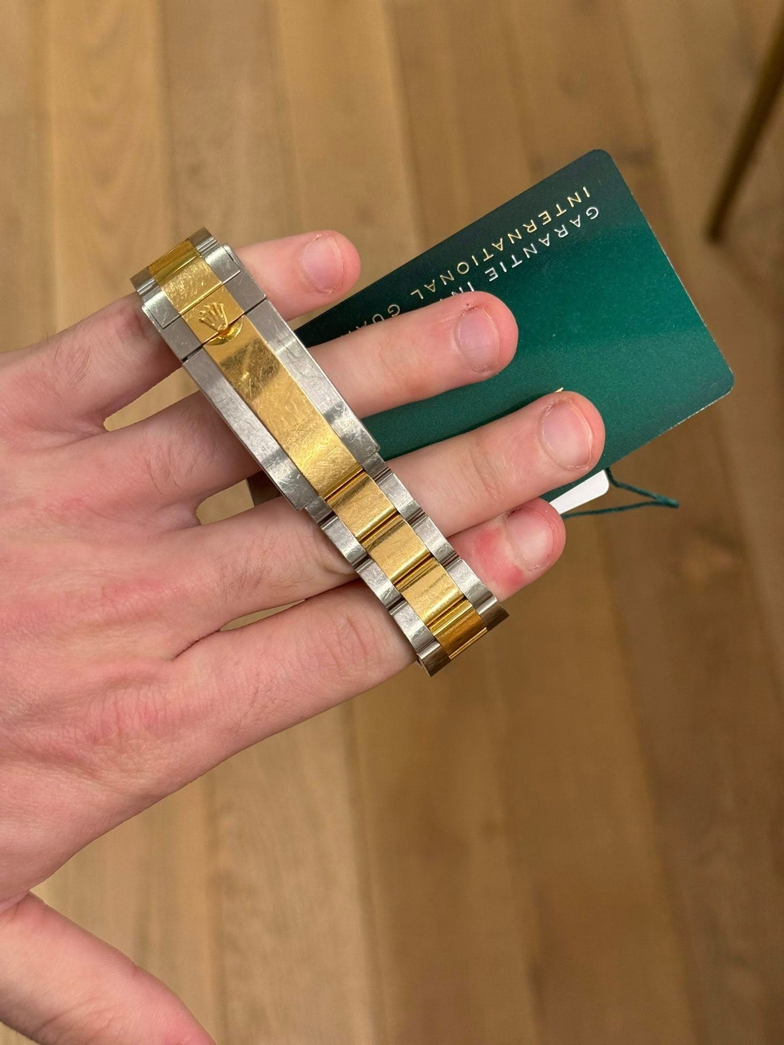 May be an image of wrist watch and text