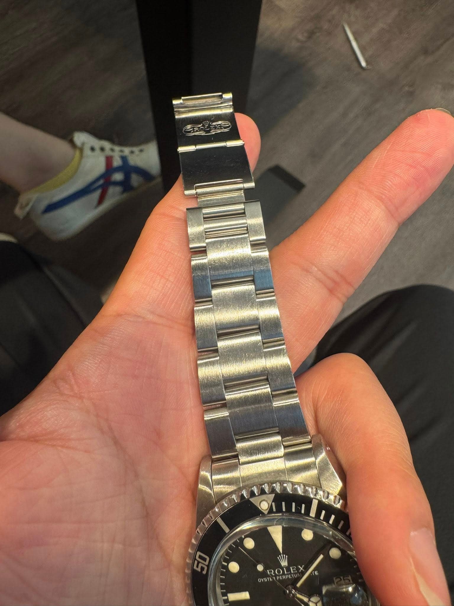 May be an image of wrist watch and text