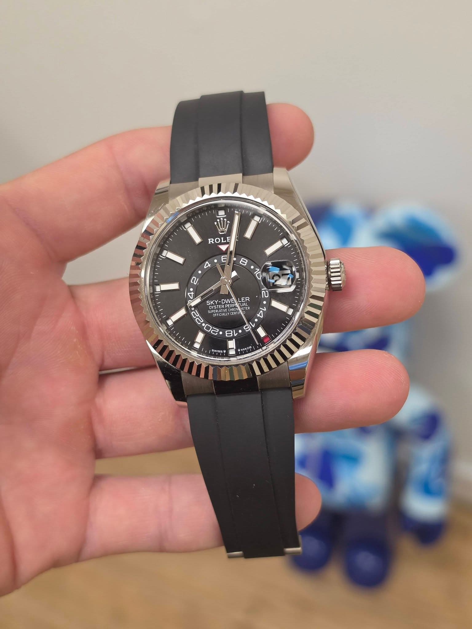 May be an image of wrist watch and text