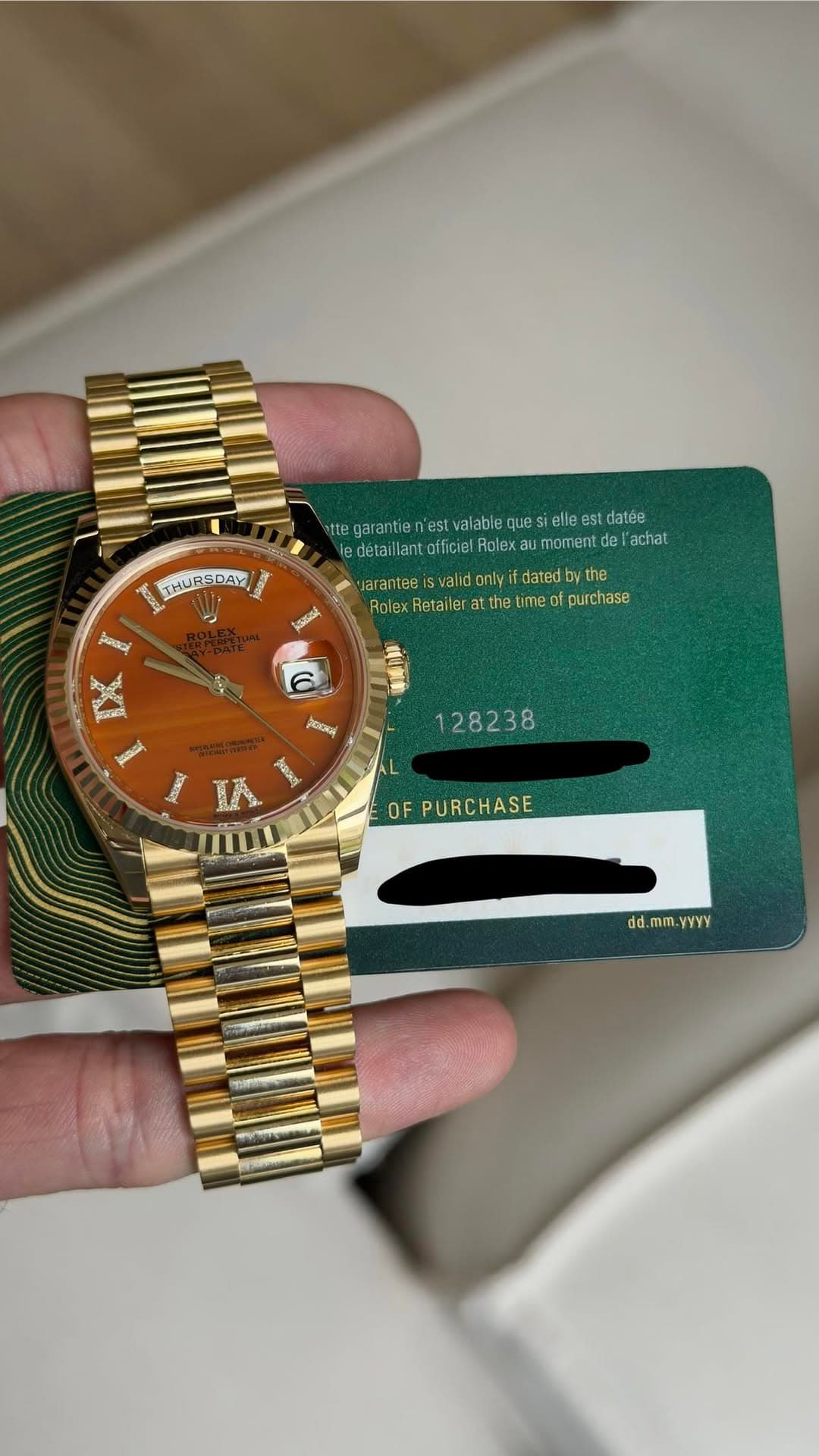 May be an image of wrist watch and text