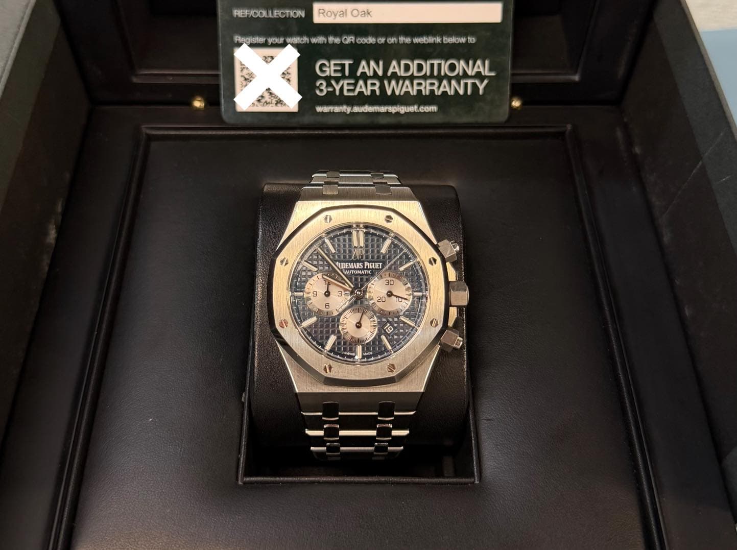 May be an image of wrist watch and text that says 'REF/DOLLECTION Royal Oak Register your weltch with OR code weblink belowe to GET AN ADDITIONAL 3-YEAR WARRANTY warranty…